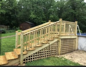Gallery: A picturesque wooden deck, showcasing its elegant design and craftsmanship. The deck features a set of stylish stairs that gracefully lead to an inviting pool, creating a mesmerizing visual masterpiece.