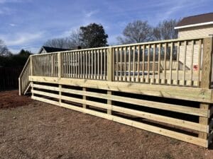 A gallery project showcasing a wooden deck with a wooden railing.