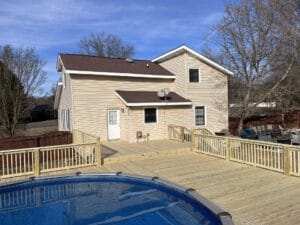A project showcasing a house with a pool and a deck.
