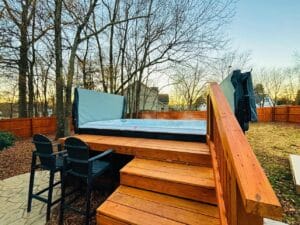 A wooden deck with a hot tub on it displayed in the Project Gallery.