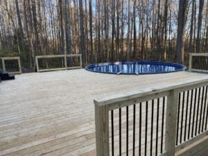 Project: A wooden deck featuring a pool in the background is showcased in this gallery.