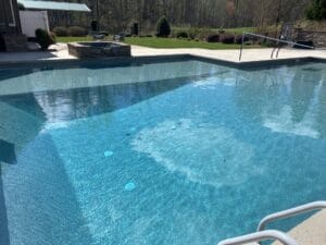 Project: A backyard swimming pool featuring a tranquil waterfall.